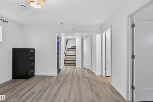 This versatile space features light-colored flooring and white walls, offering a bright and inviting atmosphere - 42 Prescott Boulevard, Spruce Grove, AB - Indoor Photo Showing Other Room