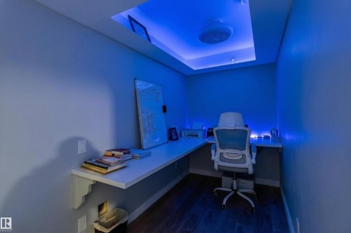 The property includes a dedicated office space with a built-in corner desk, recessed ceiling lighting, and hard flooring - 42 Prescott Boulevard, Spruce Grove, AB - Indoor Photo Showing Other Room