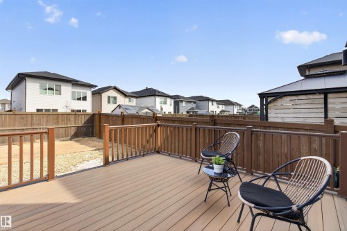 The property features a spacious outdoor deck with wood railings - 42 Prescott Boulevard, Spruce Grove, AB - Outdoor With Deck Patio Veranda With Exterior