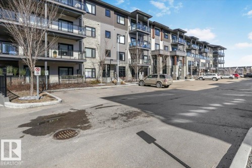 This property features a contemporary exterior with balconies, providing outdoor living spaces - 214 528 Griesbach Parade Parade, Edmonton, AB - Outdoor With Balcony With Facade