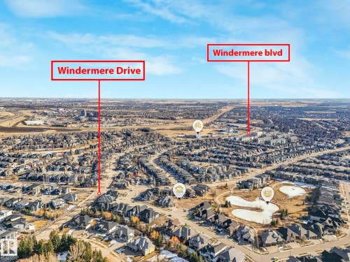 Aerial view showcasing the extensive residential development with numerous properties and a large pond feature - 2794 Wheaton Drive, Edmonton, AB 