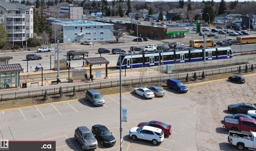 The property offers convenient access to public transportation with a light rail transit line and station visible in the immediate vicinity - 303 8215 83 Avenue, Edmonton, AB - Outdoor