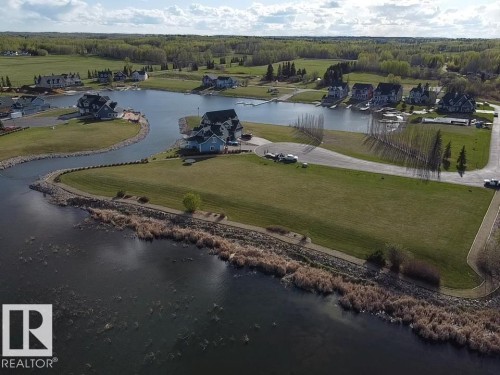 This property offers extensive green space and direct access to a private waterway - #1 Sunset Harbour, Rural Wetaskiwin County, AB 