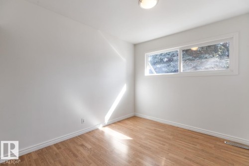 Room featuring hardwood floors and a window - 13108 133 Street, Edmonton, AB - Indoor Photo Showing Other Room