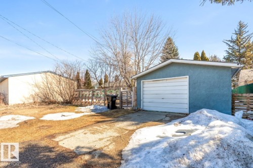 The property features a detached garage with a white overhead door - 13108 133 Street, Edmonton, AB - Outdoor