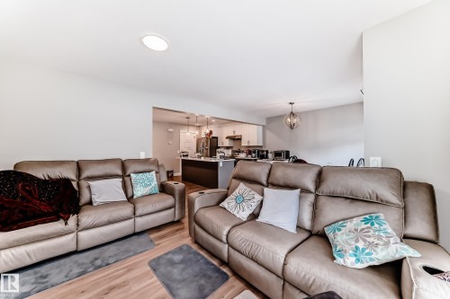 Living area featuring light wood flooring and light-colored walls - 7822 Koruluk Link Link, Edmonton, AB - Indoor Photo Showing Living Room