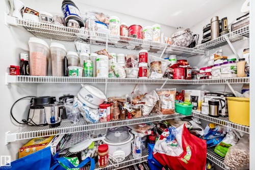 The property features a dedicated pantry space with white wire shelving, providing extensive storage options - 7822 Koruluk Link Link, Edmonton, AB - Indoor With Storage
