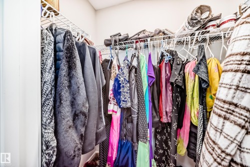 The property includes a closet featuring white wire shelving and hanging rods - 7822 Koruluk Link Link, Edmonton, AB - Indoor With Storage