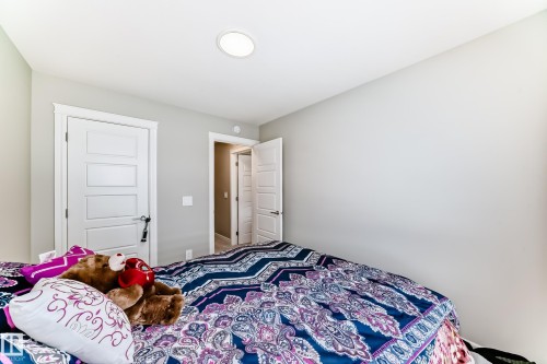 This room features light gray walls and white trim - 7822 Koruluk Link Link, Edmonton, AB - Indoor Photo Showing Bedroom