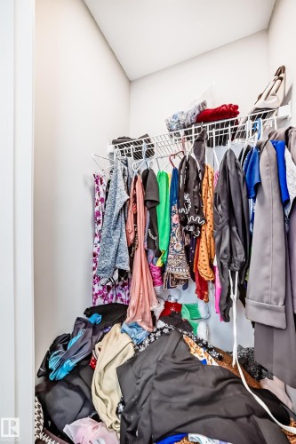 The property features a walk-in closet with white wire shelving and hanging rods for storage - 7822 Koruluk Link Link, Edmonton, AB - Indoor With Storage