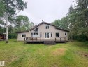Expansive rear deck featuring wood construction and direct access to the interior - #4 Kingbird Road, Rural Bonnyville M.D., AB 