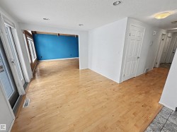 The property features light-toned hardwood flooring throughout this area - 