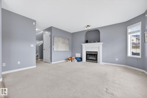 1103 117 Street, Edmonton, AB - Indoor Photo Showing Living Room With Fireplace