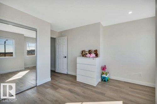 Interior space featuring light-toned walls, recessed lighting, and wood-style flooring - 13007 213 Street, Edmonton, AB - Indoor Photo Showing Other Room