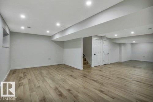 Expansive room featuring light-colored flooring, recessed lighting, and a neutral wall palette - 13007 213 Street, Edmonton, AB - Indoor