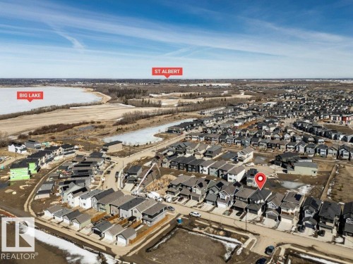 Aerial view of the neighborhood with residential properties, open land, and a body of water - 13007 213 Street, Edmonton, AB - Outdoor With View