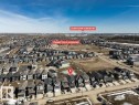 Aerial view of the residential area, showcasing numerous properties under a clear sky - 13007 213 Street, Edmonton, AB  - Outdoor With View 