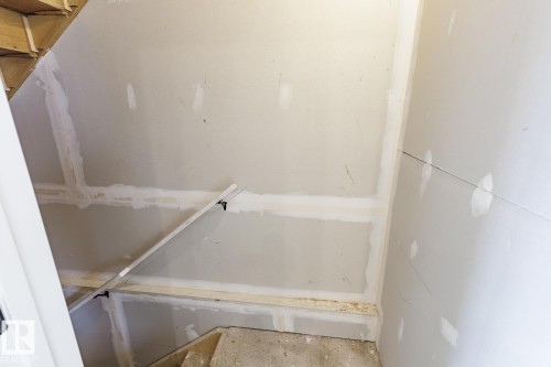 The property features unfinished interior walls, providing an opportunity for custom finishes - 3828 38 Street E, Beaumont, AB - Indoor Photo Showing Other Room