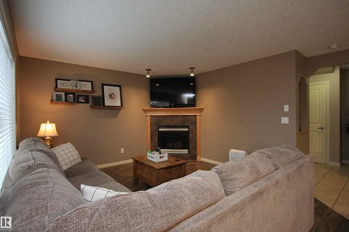 7 Ashgrove, Spruce Grove, AB - Indoor Photo Showing Living Room With Fireplace