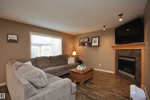 7 Ashgrove, Spruce Grove, AB - Indoor Photo Showing Living Room With Fireplace