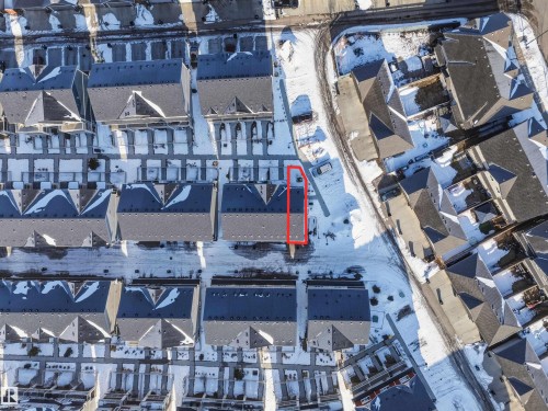 Aerial view of the property and surrounding neighborhood, featuring sloped roofs and paved areas - 58 1110 Daniels Link Link, Edmonton, AB - Outdoor