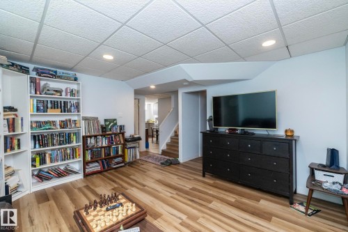 Living area featuring light wood-style flooring, recessed lighting, and white walls - 12 Mill Drive, St. Albert, AB - Indoor