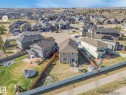 Aerial view of the property and its surrounding neighbourhood, featuring paved streets and established homes - 3910 49 Avenue, Beaumont, AB  - Outdoor With View 