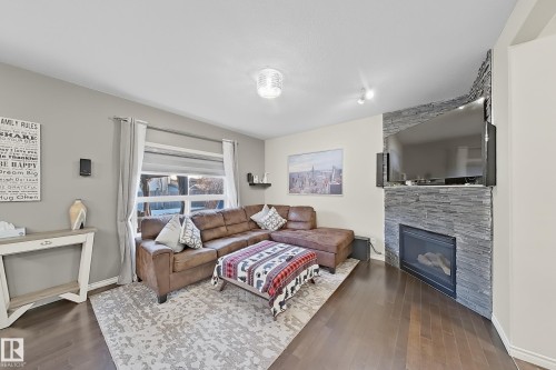 3215 22 Avenue, Edmonton, AB - Indoor Photo Showing Living Room With Fireplace