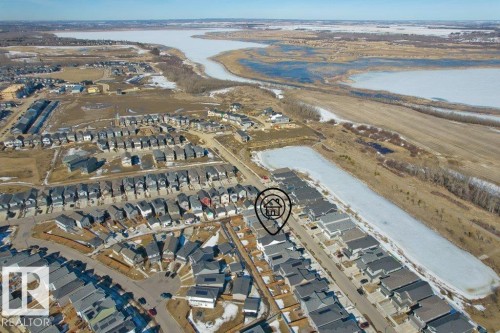 Aerial view showcasing the community's proximity to a body of water and surrounding open terrain - 21003 131 Avenue, Edmonton, AB - Outdoor With Body Of Water With View