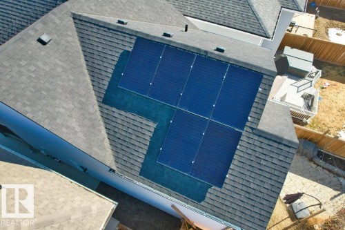 The property features a shingled roof with installed solar panels - 21003 131 Avenue, Edmonton, AB - Outdoor