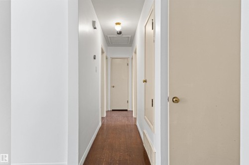 Hallway featuring hardwood flooring, white walls, and a ceiling-mounted light fixture - 8608 156 Street, Edmonton, AB - Indoor Photo Showing Other Room