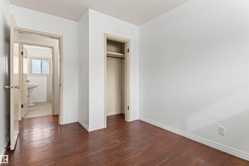 Room featuring white walls and dark wood flooring - 8608 156 Street, Edmonton, AB - Indoor Photo Showing Other Room