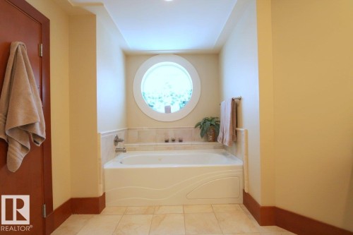 Bathroom with a garden tub and tile patterned flooring - 1402 9707 105 Street, Edmonton, AB - Indoor Photo Showing Bathroom