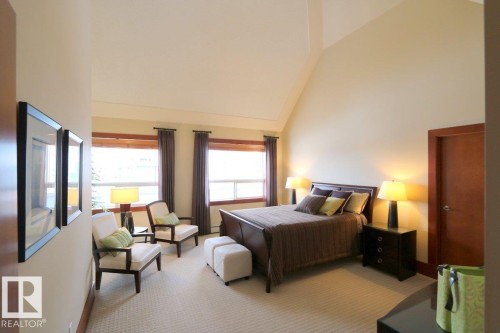 Bedroom with high vaulted ceiling and carpet flooring - 1402 9707 105 Street, Edmonton, AB - Indoor Photo Showing Bedroom