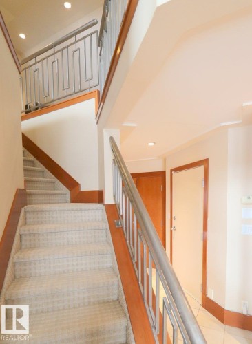 Stairs featuring recessed lighting - 1402 9707 105 Street, Edmonton, AB - Indoor Photo Showing Other Room