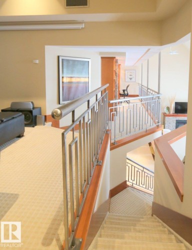 Stairs with carpet floors - 1402 9707 105 Street, Edmonton, AB - Indoor Photo Showing Other Room