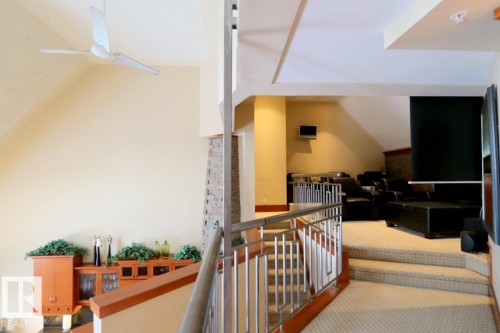 Stairs featuring carpet floors and a ceiling fan - 1402 9707 105 Street, Edmonton, AB -  Photo Showing Other Room