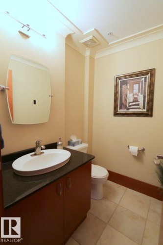 Bathroom featuring vanity, light tile patterned floors, and crown molding - 1402 9707 105 Street, Edmonton, AB - Indoor Photo Showing Bathroom