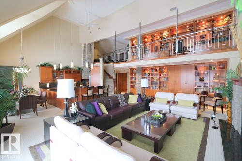 Community lobby with high vaulted ceiling and stairway - 1402 9707 105 Street, Edmonton, AB - Indoor Photo Showing Living Room