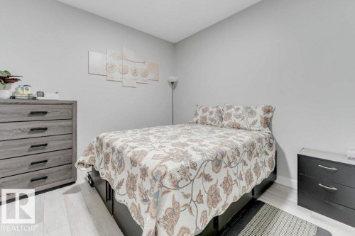 This room features neutral-toned walls and light-colored flooring - 452 Roberts Crescent, Leduc, AB - Indoor Photo Showing Bedroom