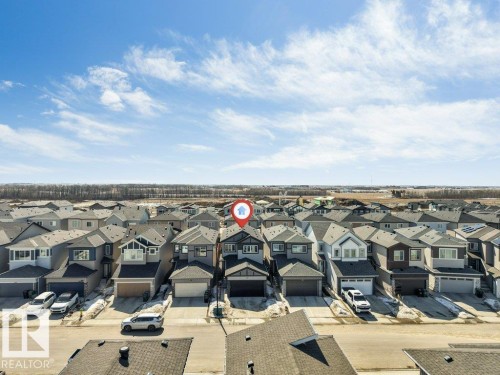 Aerial view showcasing the property within a residential neighborhood featuring detached homes and paved roads - 452 Roberts Crescent, Leduc, AB - Outdoor