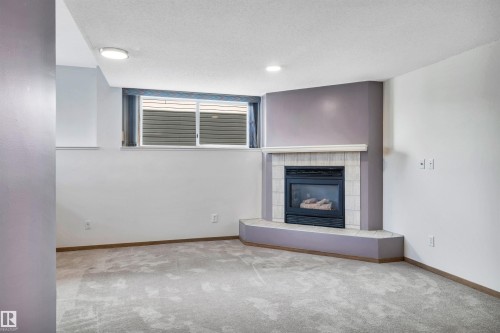 5 Donald Place, St. Albert, AB - Indoor Photo Showing Living Room With Fireplace