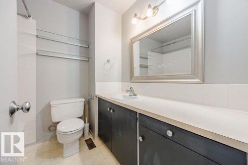 Refurbished bathroom includes a reglazed tub, newer sink, and updated plumbing fixtures. - 12032 25 Avenue, Edmonton, AB - Indoor Photo Showing Bathroom