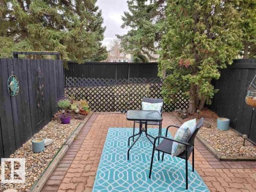 This is your beautiful back yard with paving stone patio. A wonderful private space to sit out and enjoy those warm summer days. - 12032 25 Avenue, Edmonton, AB - Outdoor With Deck Patio Veranda