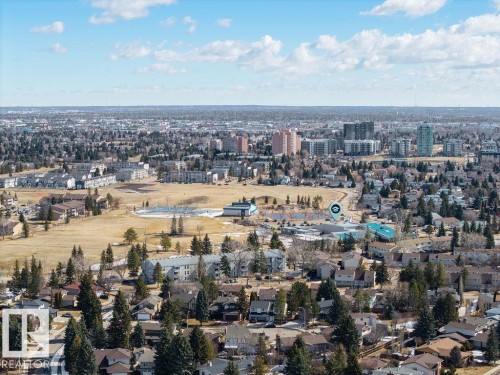 Aerial view showcasing the surrounding neighborhood with numerous homes and mature trees - 12032 25 Avenue, Edmonton, AB - Outdoor With View