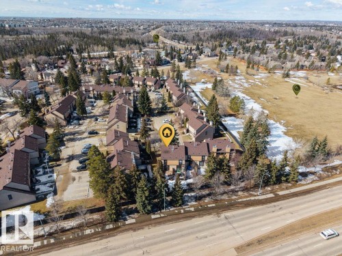 Notice the huge school yard that is directly adjacent to the complex. - 12032 25 Avenue, Edmonton, AB - Outdoor With View