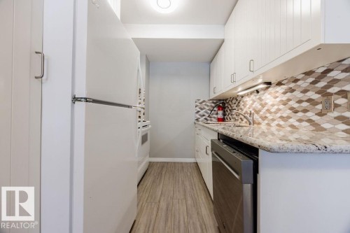 TKitchen area featuring granite countertops, stylish tile backsplash, upgraded sink, taps, and newer appliances. - 12032 25 Avenue, Edmonton, AB - Indoor Photo Showing Kitchen