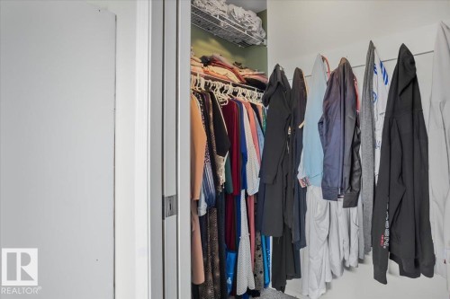 Walk-in closet with hanging clothes storage and a wire shelf - 3119 32 Avenue, Edmonton, AB - Indoor With Storage