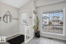 Entryway featuring light-colored walls and a window with horizontal blinds - 3119 32 Avenue, Edmonton, AB  - Indoor Photo Showing Other Room 