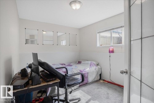 This room features light-colored walls and a window providing natural light - 3119 32 Avenue, Edmonton, AB - Indoor Photo Showing Bedroom